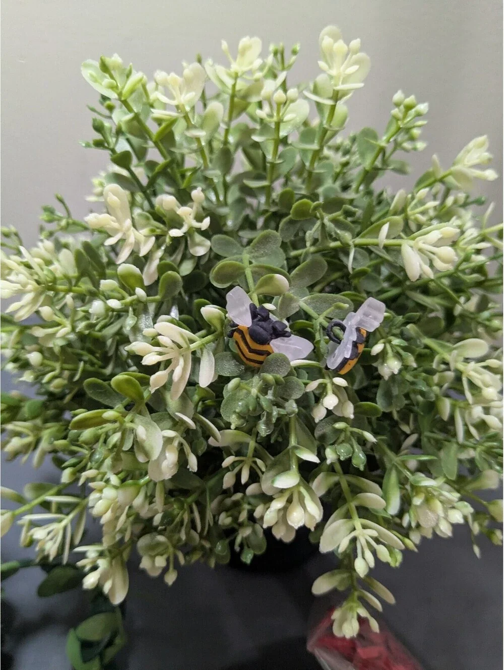 Artificial Flower Arrangement with Decorative Greenery and Shredded Paper Filler